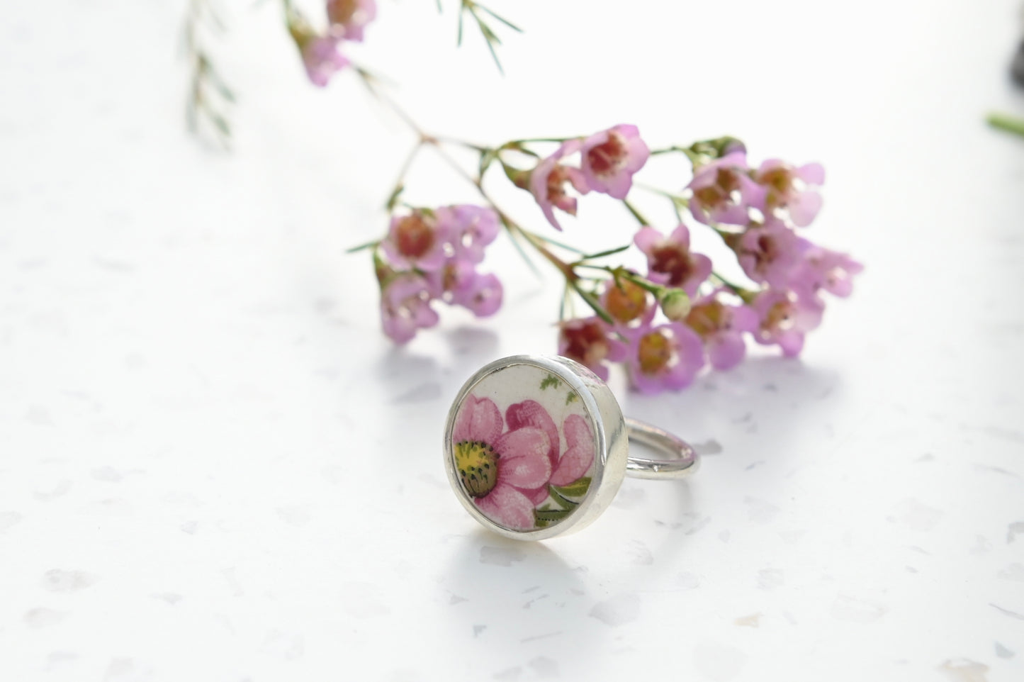 Pink bloom from broken China set in silver