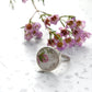 Pink and green floral china ring in sterling silver bezel setting - side angle view