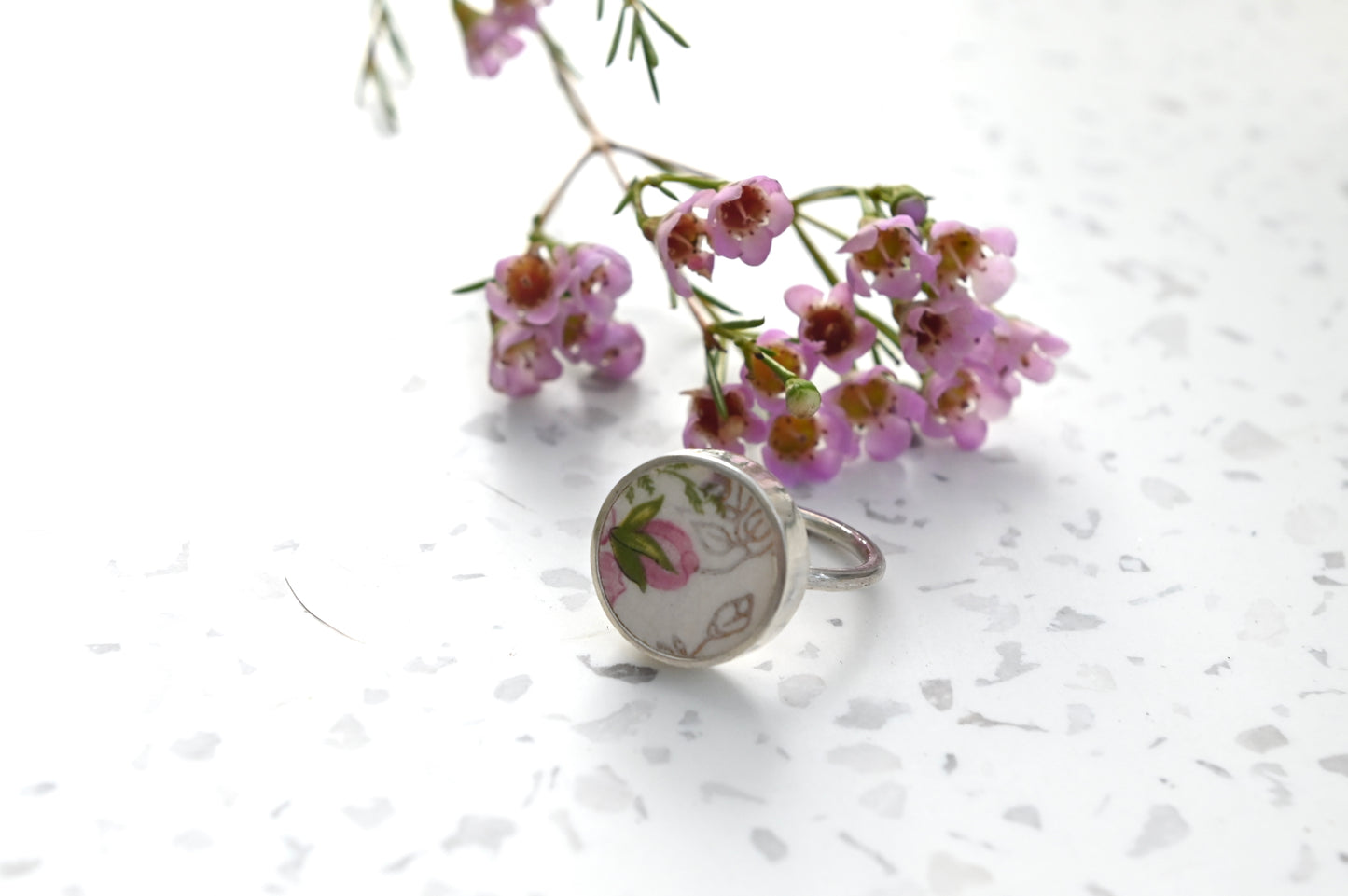 Pink and green floral ceramic set in silver ring