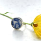 Blue and white ceramic ring set with sterling silver