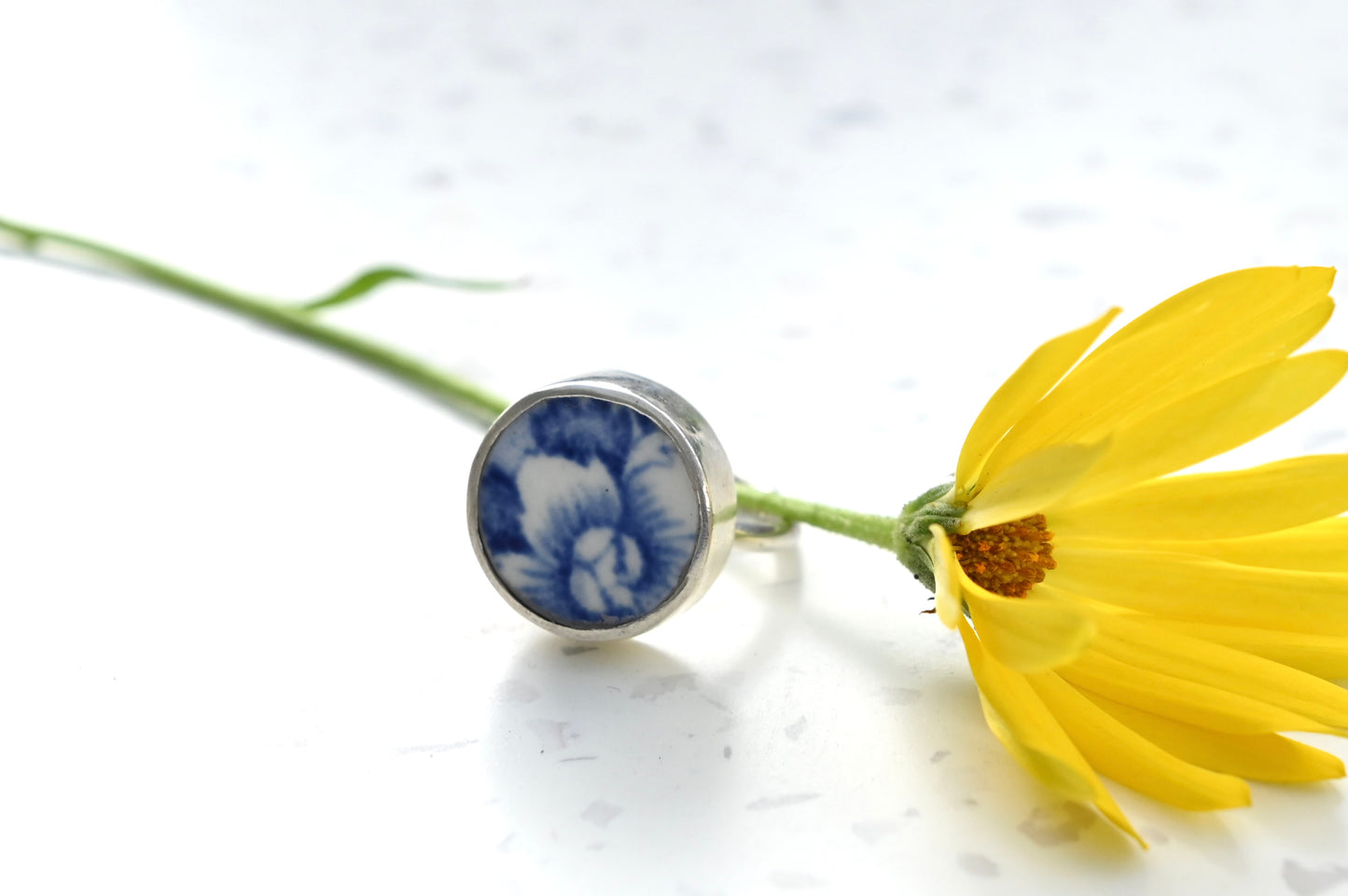 Blue and white ceramic ring set with sterling silver