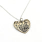 Protea Heart Pendant – angled hanging view – oxidised sterling silver necklace