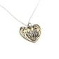 Protea Heart Pendant – brass variant angled view showing protea etching detail on white background