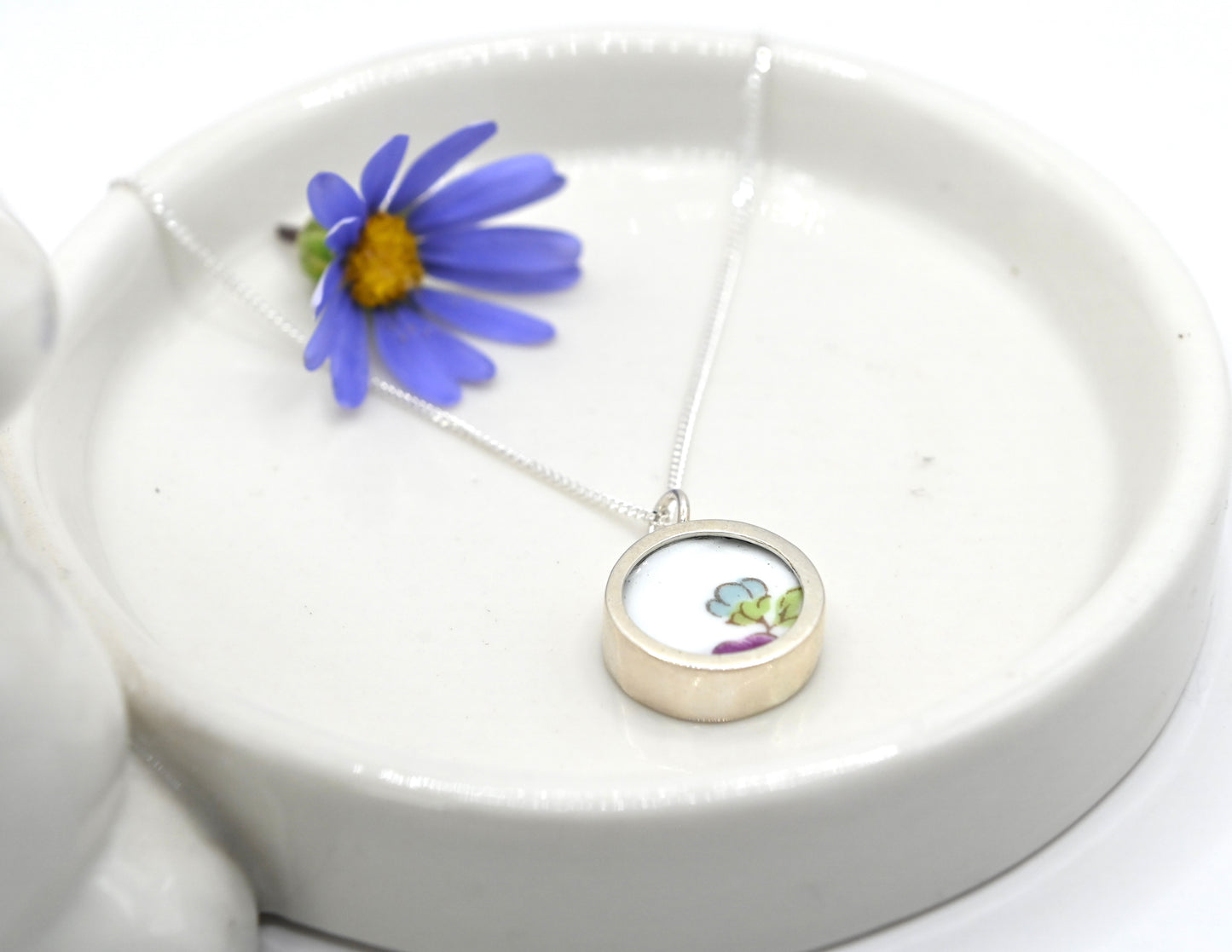 Double sided pendant made with broken china and sterling silver