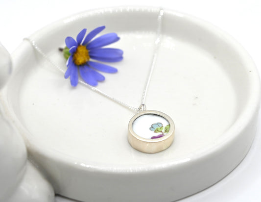Double sided pendant made with broken china and sterling silver