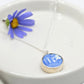 Double sided pendant made with broken china and sterling silver