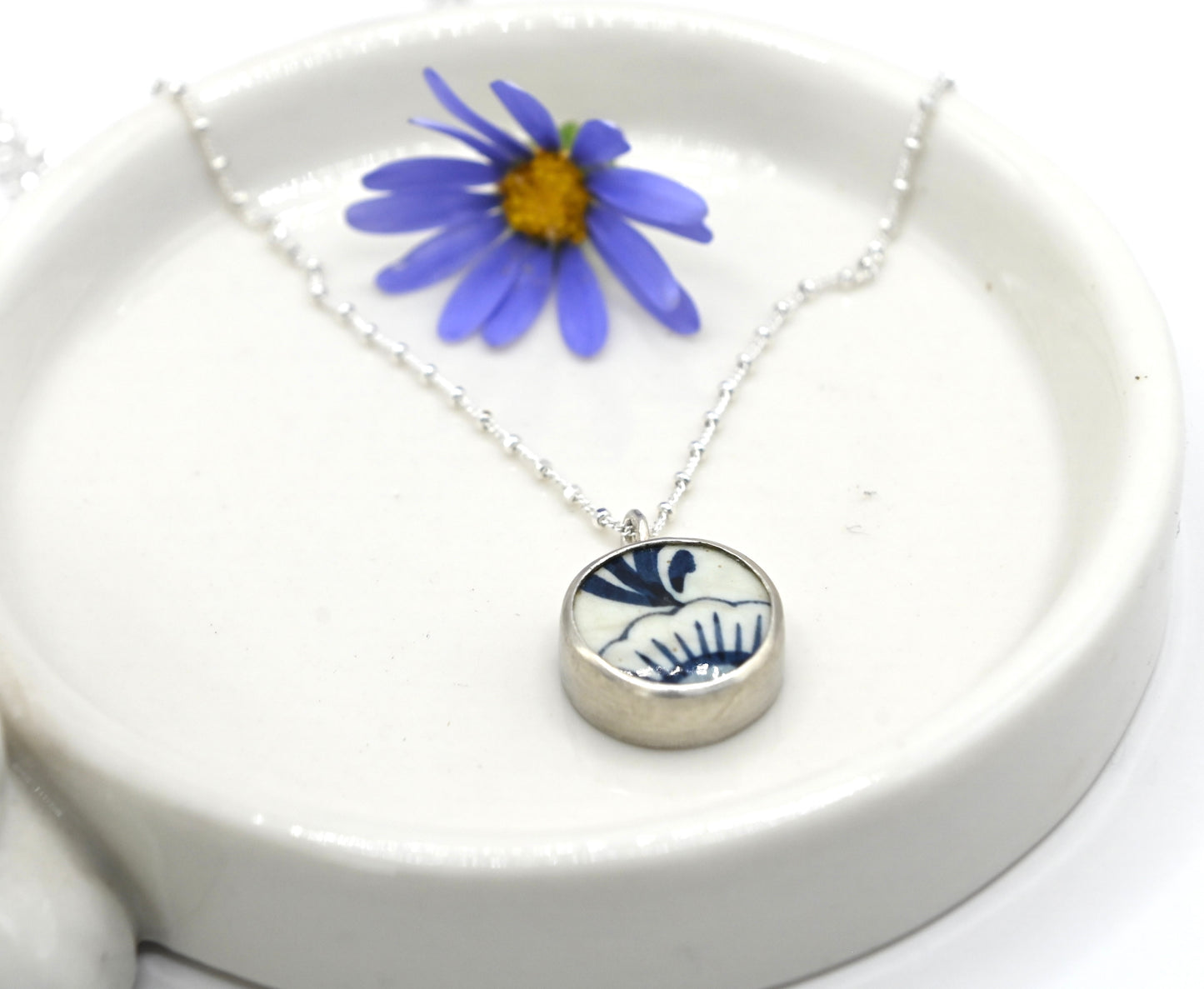 Double sided pendant made with broken china and sterling silver