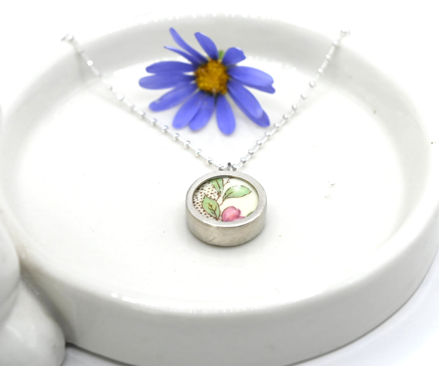 Double sided pendant made with broken china and sterling silver