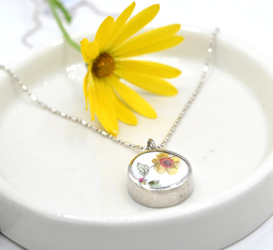 Double sided pendant with broken china