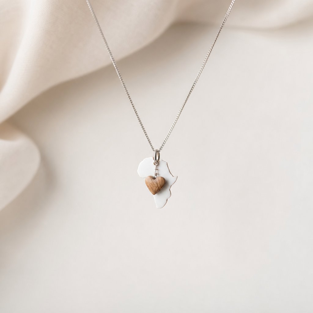 Africa Silhouette Pendant - front view sterling silver with hand-carved olive wood heart charm