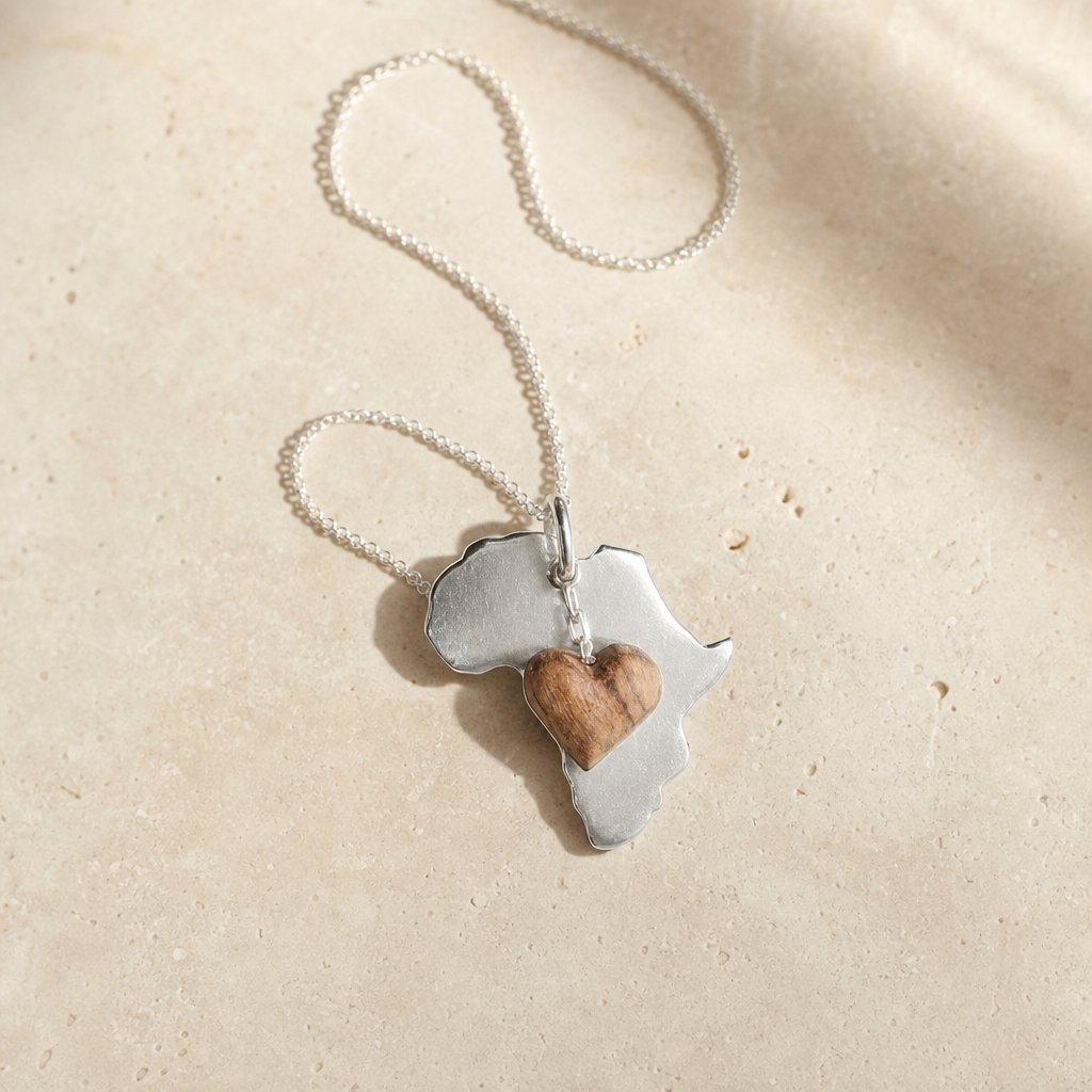 Africa Silhouette Pendant - front view sterling silver with hand-carved olive wood heart charm