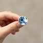 Blue and white antique ceramic ring - front view sterling silver bezel setting on wooden ring stand