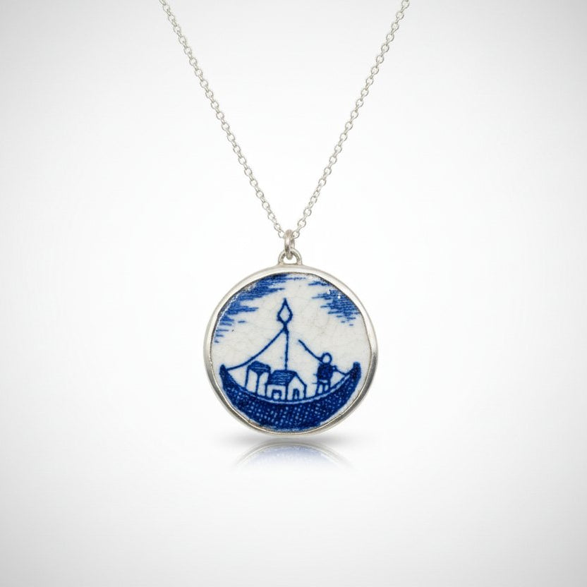 Blue and white willow pattern ceramic pendant - angled side view showing sterling silver bezel depth and chain