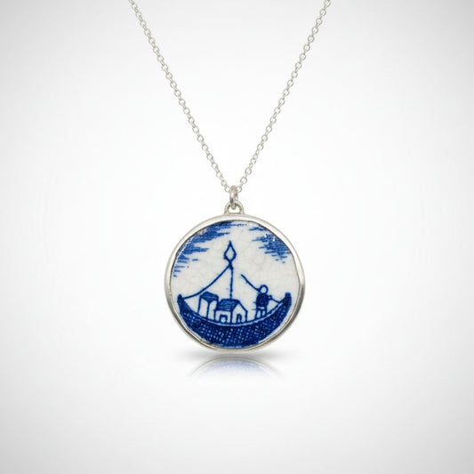 Blue and white willow pattern ceramic pendant - angled side view showing sterling silver bezel depth and chain