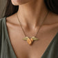 Brass Winged Wooden Heart Necklace - front view showing olive wood and African Blackwood variants with brass wings