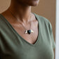 Brass Winged Wooden Heart Necklace - front view showing olive wood and African Blackwood variants with brass wings