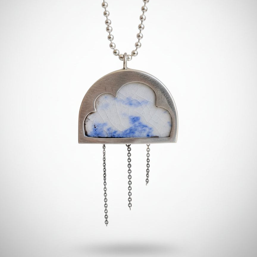Cloud Pendant - front view, sterling silver with antique blue and white ceramic inlay and hanging chain details