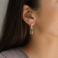 Cowry Shell Hoop Earrings - close-up portrait brass cowry charm detail on silver hoop