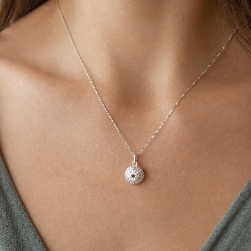 Small Sea Urchin Necklace - close-up detail of sterling silver sea urchin pendant showing handcrafted cast texture