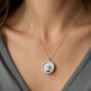Double-sided broken china pendant - front face floral motif set in sterling silver bezel