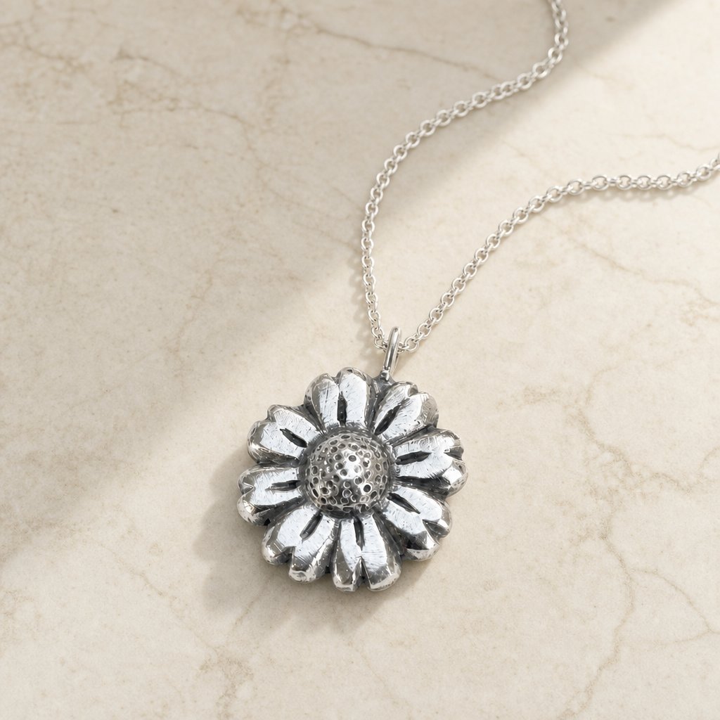Daisy Flower Pendant - close-up of shiny sterling silver petals and textured centre detail