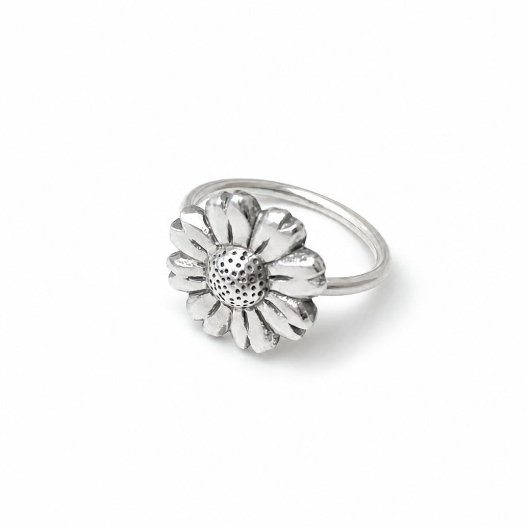 Daisy Flower Ring - elevated angle plain sterling silver, showing petal depth and hammer-textured centre