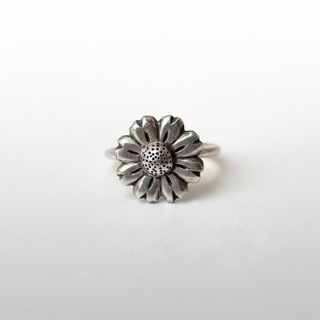 Daisy Flower Ring - front view brass, warm golden tone with textured pollen centre detail