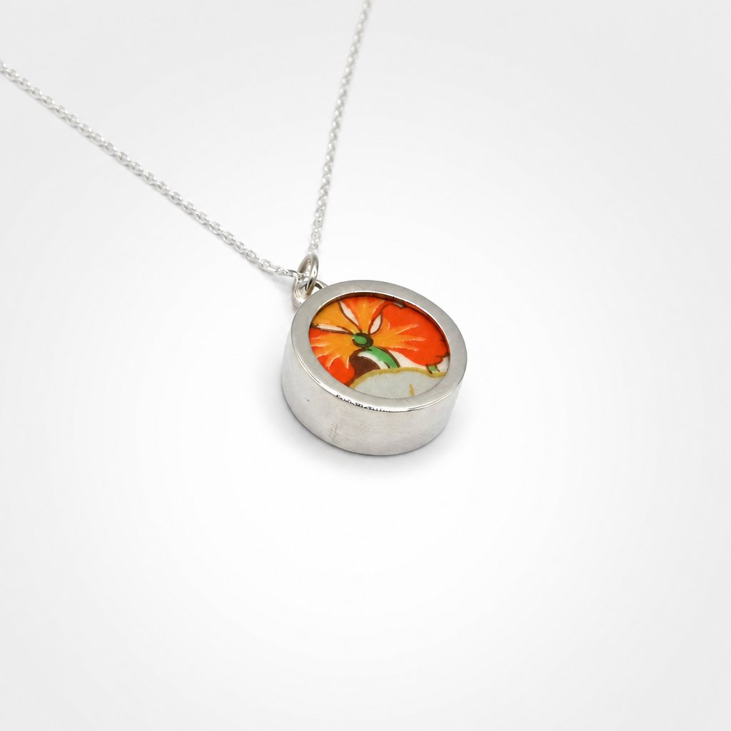 Double Bloom Shard Pendant - front-facing close-up bold orange floral antique china shard in sterling silver bezel necklace