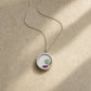 Double-sided broken china pendant - reverse blue willow pattern set in sterling silver bezel
