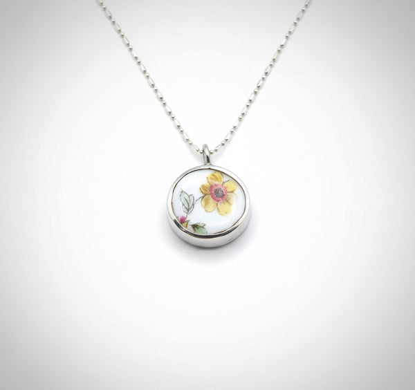Double sided pendant with broken china