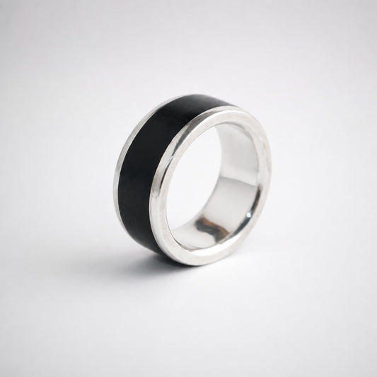 African Blackwood and sterling silver men's band ring - three-quarter view showing wood inlay and silver shoulders