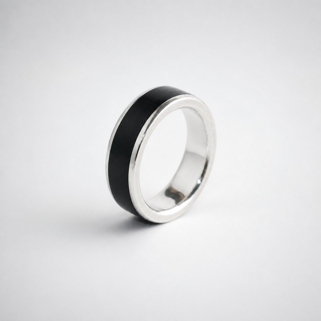 African Blackwood and sterling silver men's band ring - narrow 4mm variant showing fine wood stripe and polished silver edges