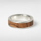 Men's olive wood and sterling silver wedding band - three-quarter angle view showing wood grain inlay