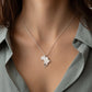 Africa Necklace with an Africa heart cut out shaped pendant worn by a person wearing a light gray shirt.