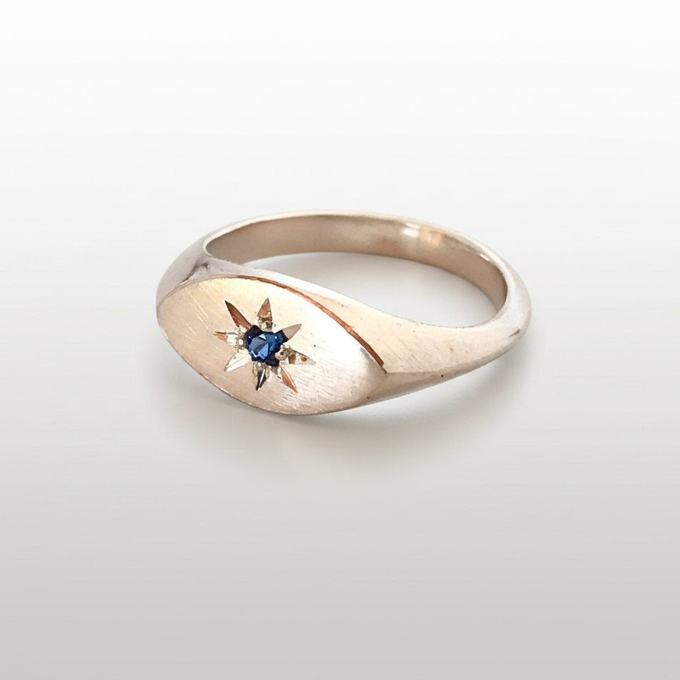 Ladies Pinky Signet Ring - hero front angle, sterling silver with blue topaz star setting