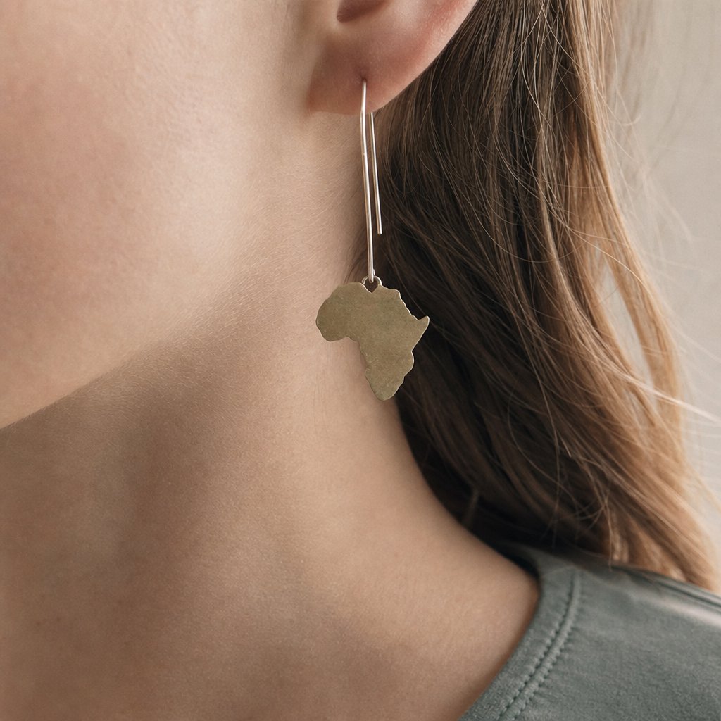 Large Africa Hook Earrings - on-model close-up showing full drop length, hand-pierced brass continent silhouette