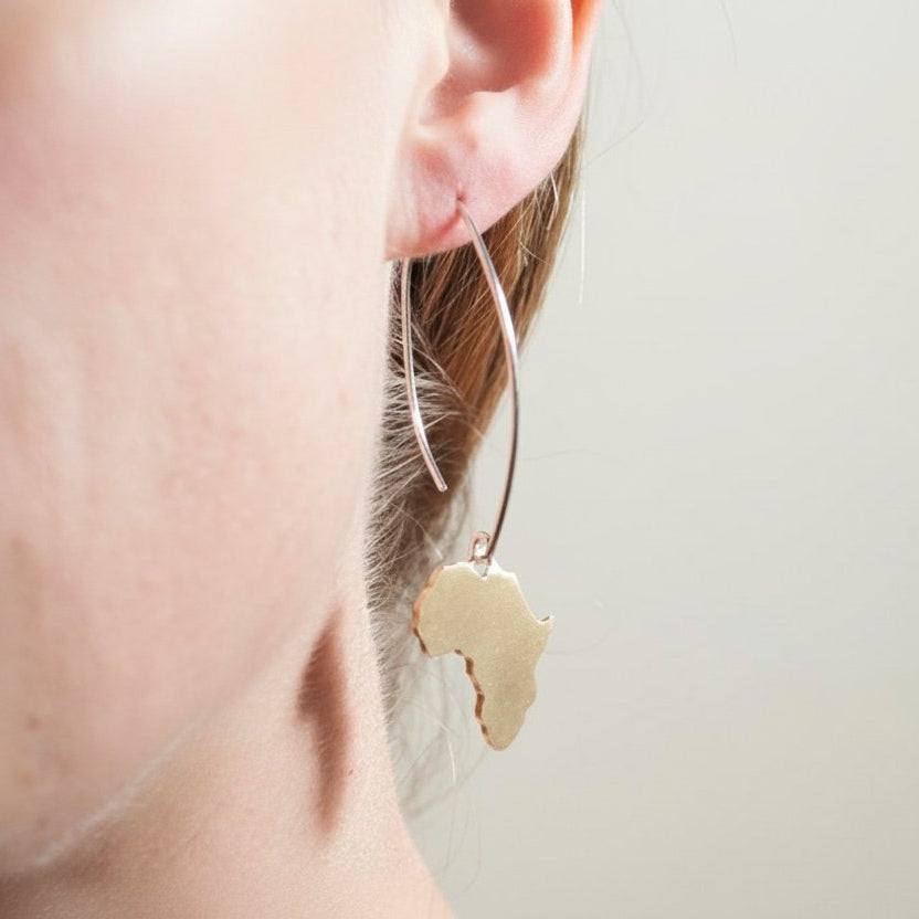 Large Africa Hook Earrings - on-model side view, hand-pierced brass pendant on sterling silver hook
