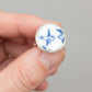 Lovebird Ring - worn on hand showing scale, antique willow pattern blue ceramic bezel set in sterling silver, size UK Q