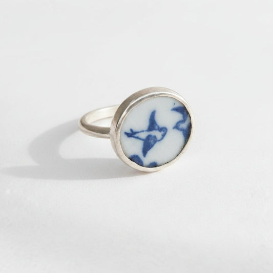 Lovebird Ring - displayed on wooden ring cone stand, antique willow pattern blue and white ceramic set in sterling silver bezel
