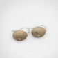 Medium Urchin Hook Earrings in brass with sterling silver hooks - flat lay on white, top-view showing warm brass tone