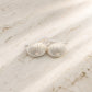 Medium Urchin Hook Earrings in sterling silver - flat lay on white showing soldered silver hook and urchin texture