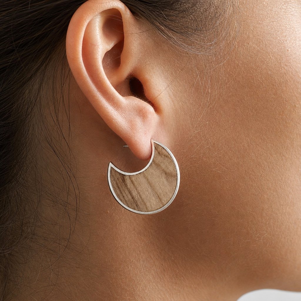 Moon Stud Earrings with Olive Wood - on model close-up showing crescent sterling silver frame and olive wood grain insert