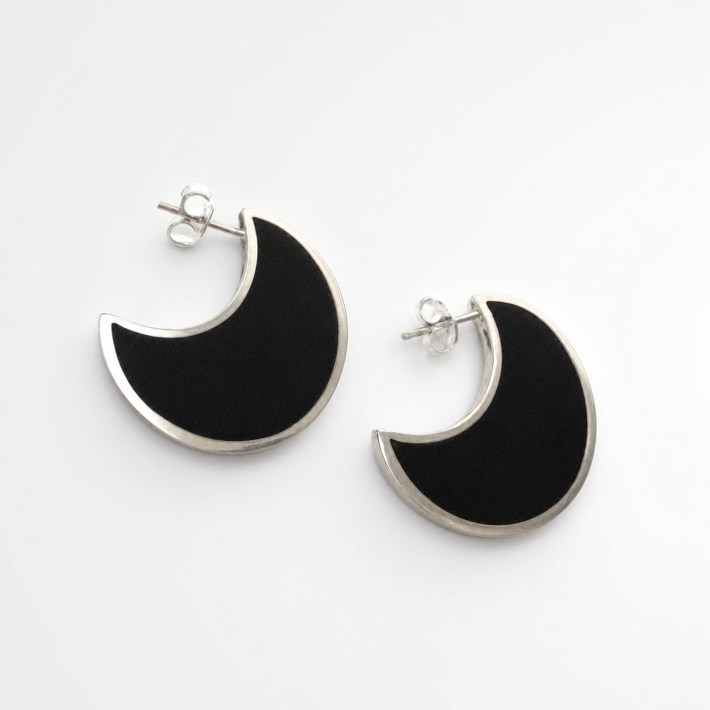 Moon Stud Earrings - African Blackwood crescent studs angled view showing sterling silver bezel depth and dark wood insert