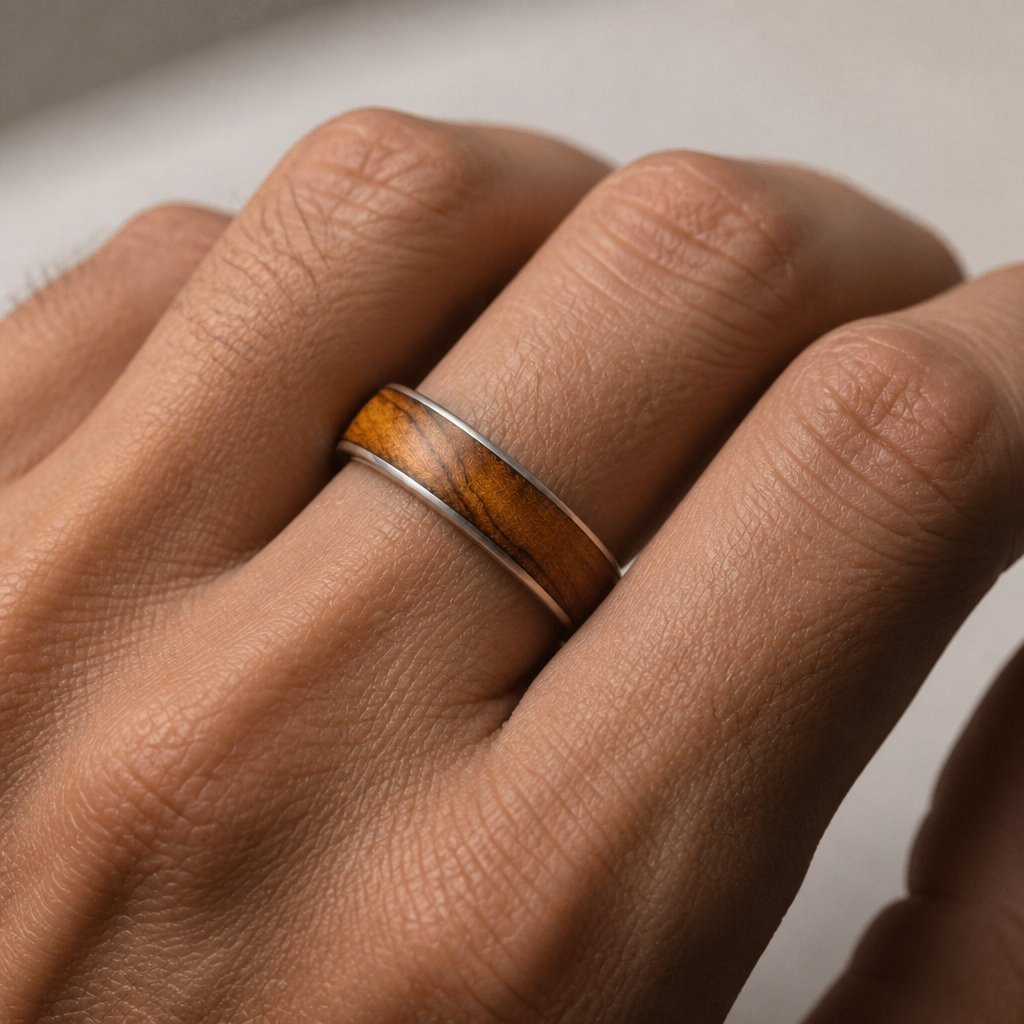 Olive Wood & Sterling Silver Ring - angled hero view showing wood grain and silver band