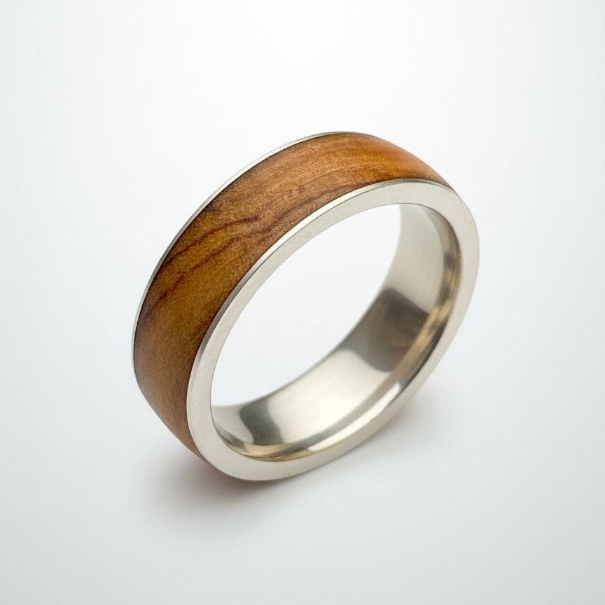 Olive Wood & Sterling Silver Ring - angled hero view showing wood grain and silver band