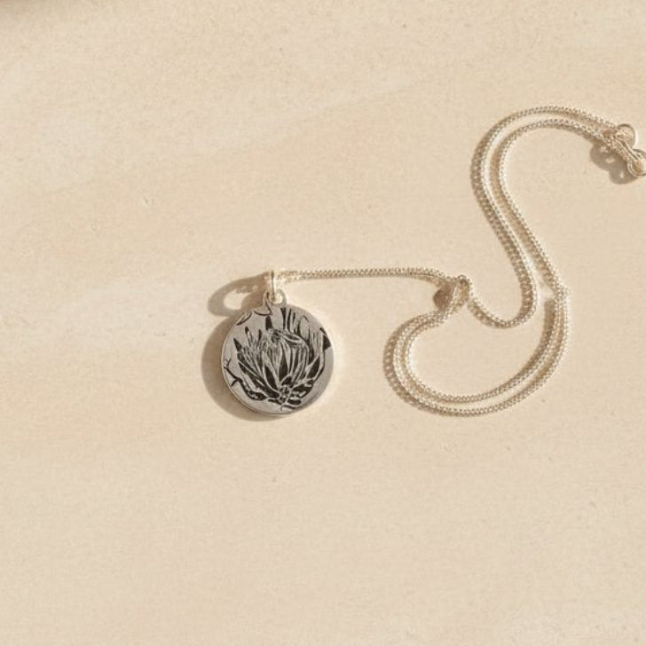 Silver Protea Disc Pendant - collection of handcrafted sterling silver pendants showing natural variation in each hand-pressed piece