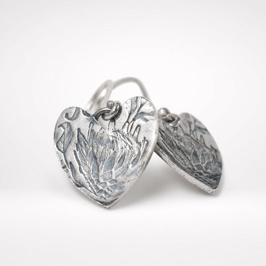 Handcrafted Protea Heart Hook Earrings - flat lay product shot sterling silver etched detail