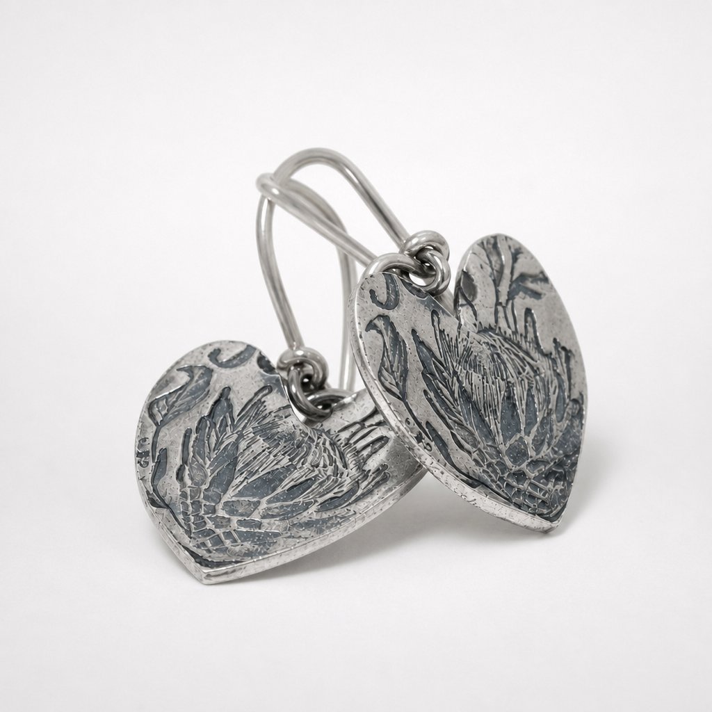 Large Protea Heart sterling silver hook earrings - close-up showing detail South African protea flower engraving
