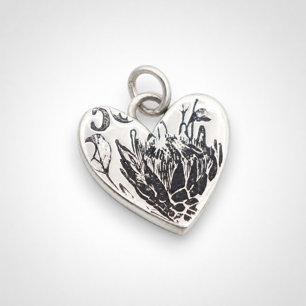 Protea Heart Pendant – close-up oxidised protea etching – sterling silver