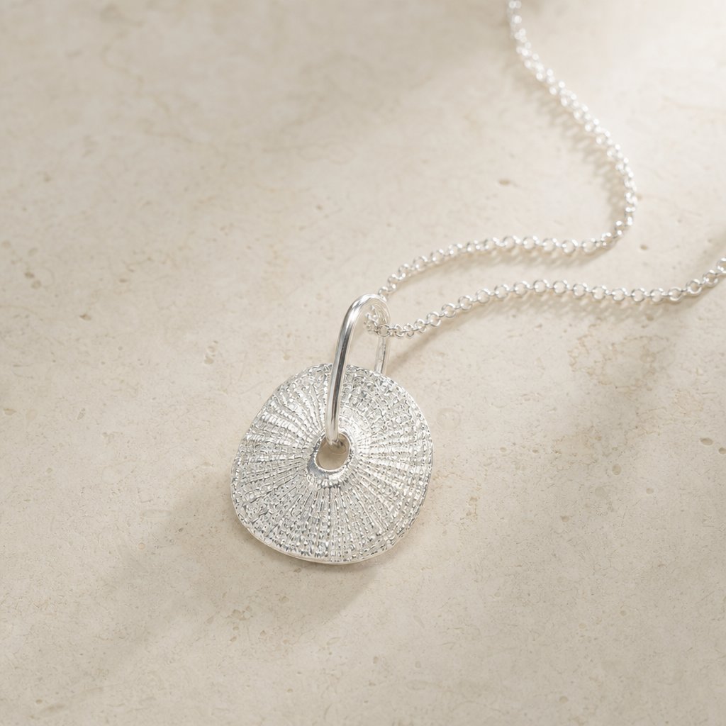 Santa Maria Shell Pendant - three-quarter angle view, sterling silver limpet shell pendant on chain